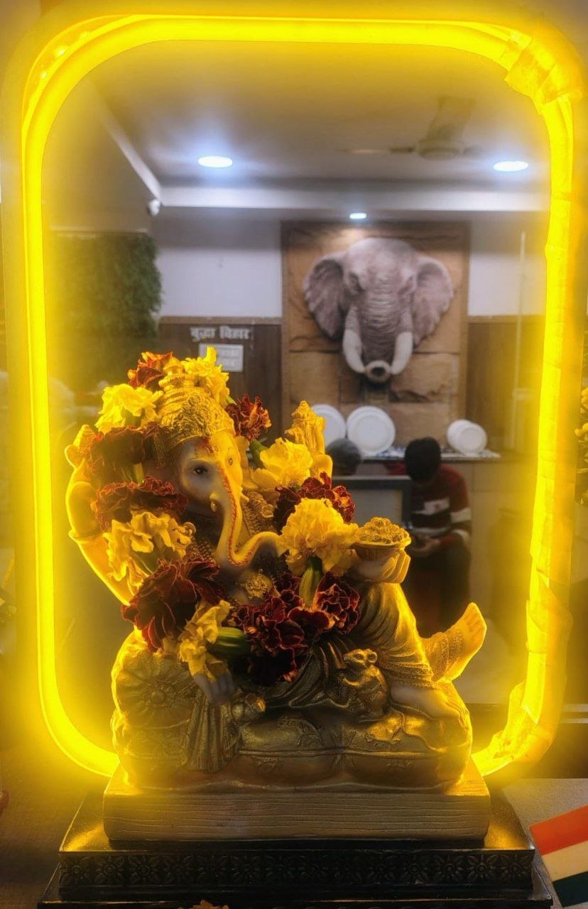 Ganesh idol with marigold flowers